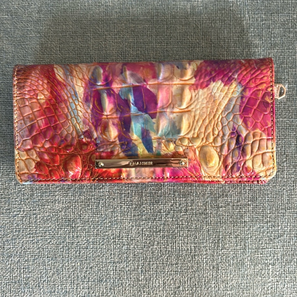 Brahmin “Ady” wallet. Dimensions 7.5”w 3.5”h .5”d. 13 card slots and 1 ID slot.